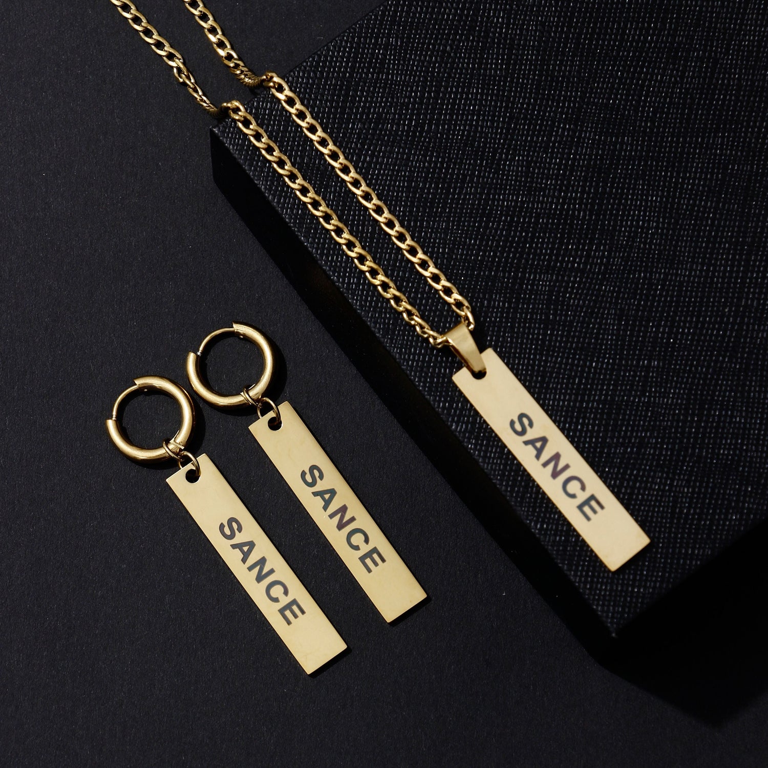SANCE jewelry picture with earrings and necklaces in gold and silver for LGBTQ+ singles find your match in real life gay lesbian queer trans bisexual